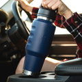 Fridgy 1L Cruise Range Bottle in Navy being taken out of a car cup holder – Double-wall vacuum insulated stainless steel drink bottle designed for travel-friendly hydration.