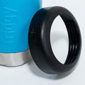 Fridgy 375ml Can Cooler in Regal Blue with its lid leaning against it – Double-wall insulated stainless steel can holder designed to keep drinks cold for hours.