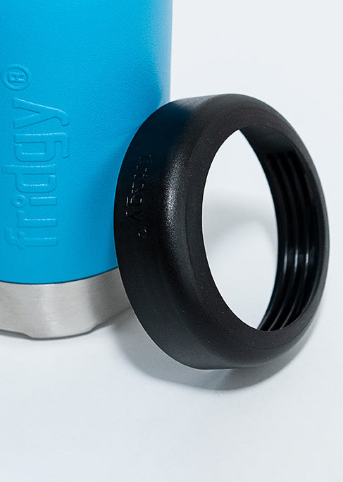 Fridgy 375ml Can Cooler in Regal Blue with its lid leaning against it – Double-wall insulated stainless steel can holder designed to keep drinks cold for hours.