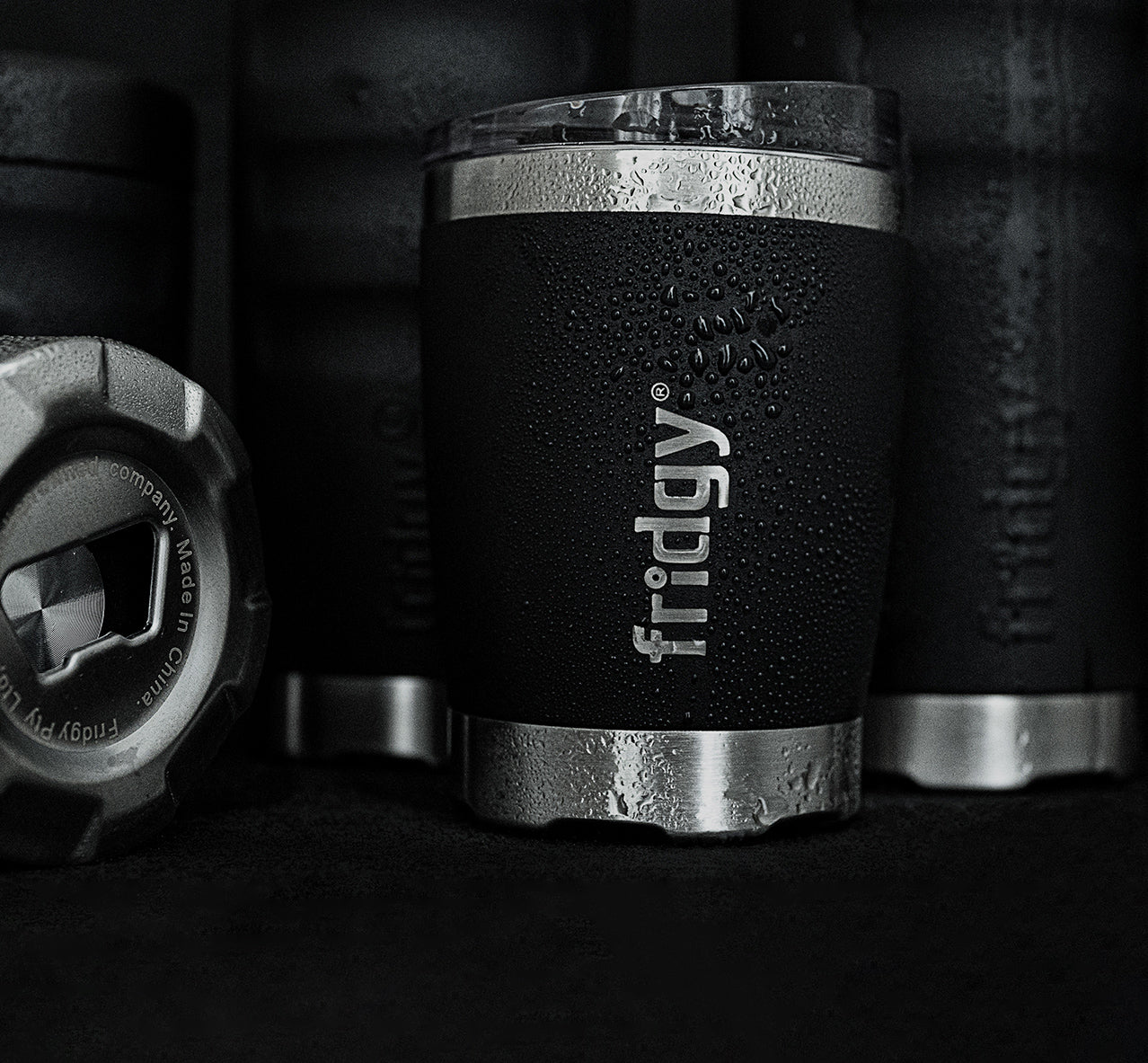 Fridgy Mini Sipper Tumbler in Black – Double-wall insulated stainless steel tumbler with water droplets on the exterior, highlighting its spill-proof lid and condensation-resistant design.