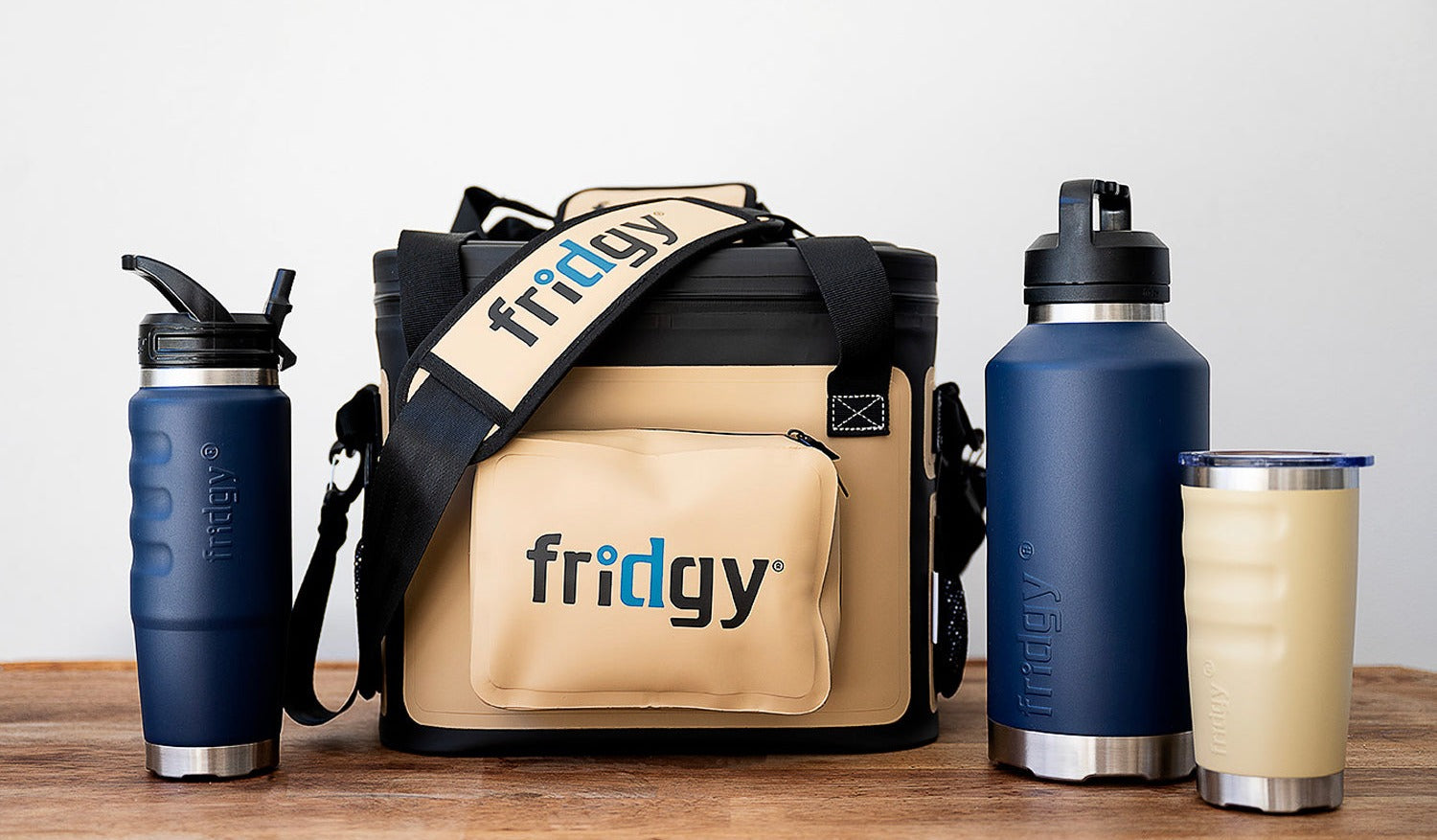 A Fridgy worksite pack: 14L cooler bag, 1.9L and 750ml bottles and a 600ml tumbler on a bench.