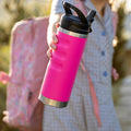 Fridgy 540ml Grip Range Bottle in Fiery Rose held in a little girl's hand – Double-wall vacuum insulated stainless steel water bottle designed for all-day hydration and durability.